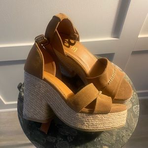Vici Doll tan platform sandals.